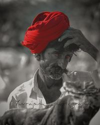 Close-up of man looking away outdoors