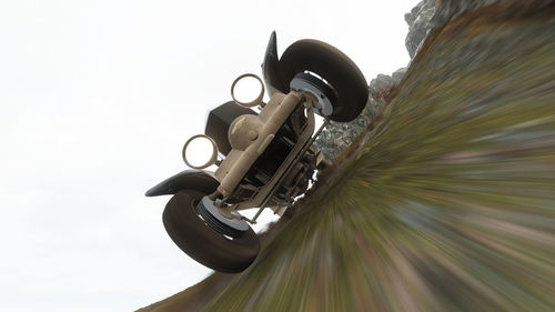 Low angle view of wheel against sky