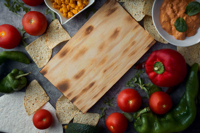 High angle view of fruits and vegetables on cutting board
