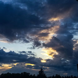 Low angle view of dramatic sky during sunset