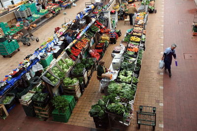 High angle view of people shopping in vegetables and fruits market