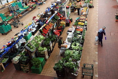 High angle view of people shopping in vegetables and fruits market