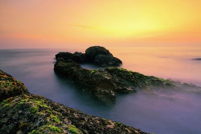 Scenic view of sea at sunset