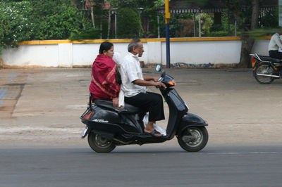 Man riding motorcycle on street