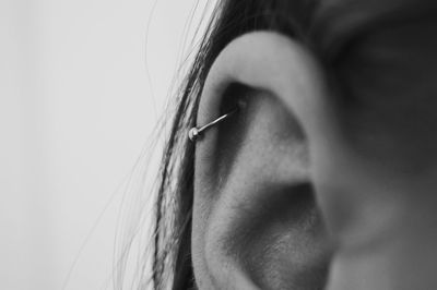 Close-up of ear with cartilage earring
