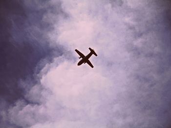 Low angle view of airplane in sky