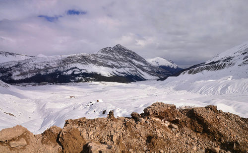 Scenic view of snowcapped mountains against sky