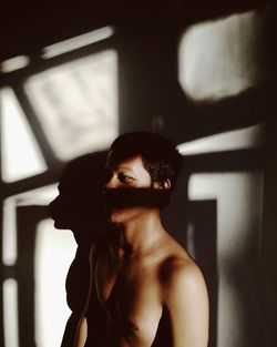 Close-up portrait of shirtless man