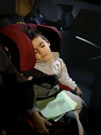 Boy sleeping in car