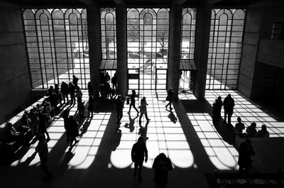 High angle view of people walking in corridor