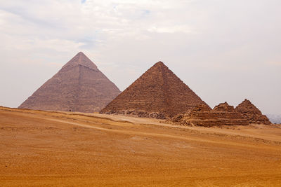 Scenic view of pyramid in desert against sky