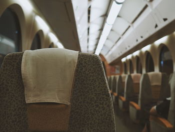 Empty seats in illuminated airplane