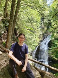 Portrait of young man in forest