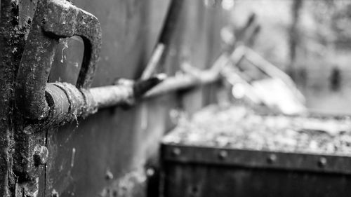 Close-up of rusty metal against wall