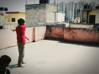 Full length of woman standing on city street