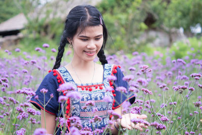 Woman with pink flower