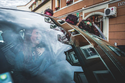 People sitting on glass window