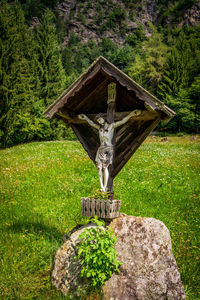 Crucifix on the meadow in the dolomites