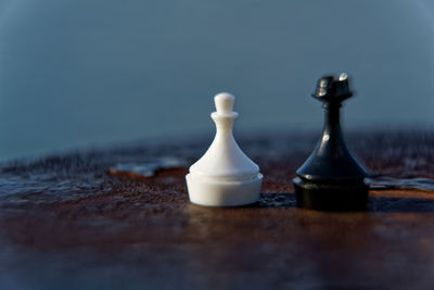 Close-up of chess pieces on table