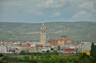 Buildings in city against sky