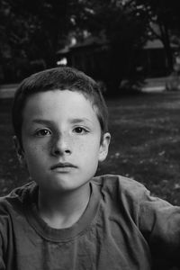 Close-up portrait of boy at park