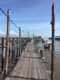 Pier on jetty against sky