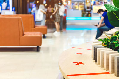 Close-up of chairs on table in restaurant