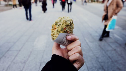 Close-up of hand holding snack