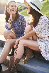 Happy couple sitting on steps