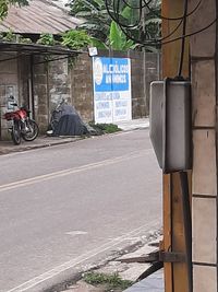 Road sign on street in city