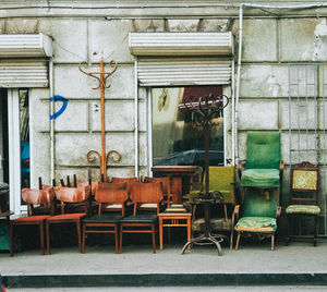 Empty chairs and table at old city