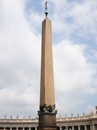 Low angle view of historical building against cloudy sky