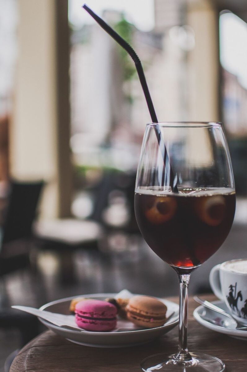 CLOSE-UP OF WINE GLASSES ON TABLE