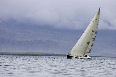 Sailboat tipping in wind in iceland