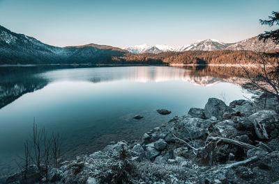 Scenic view of lake and mountains against sky