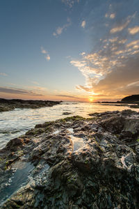 Scenic view of sea against sky during sunset