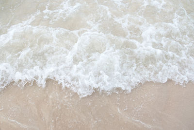 High angle view of surf on beach