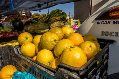 Fruits in basket for sale at market stall