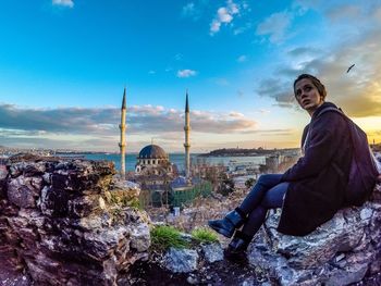 Silhouette of woman looking at cityscape