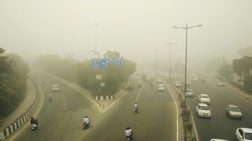 High angle view of cars on street in city
