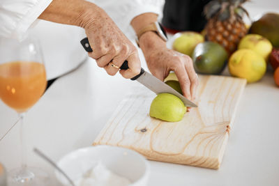 Midsection of man preparing food on table