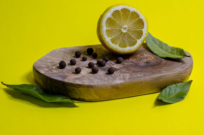 Close-up of lemon slice against yellow background