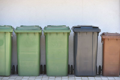 Trash cans against the wall