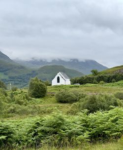 House on field against sky