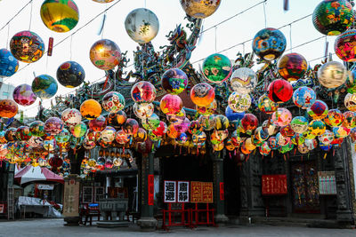 Low angle view of lanterns hanging at market stall