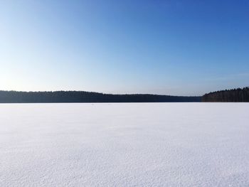 Scenic view of frozen lake against clear sky