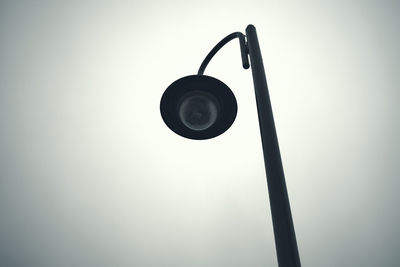 Low angle view of lamp against sky