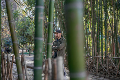 Moroccan man posing in a bamboo park in morocco.