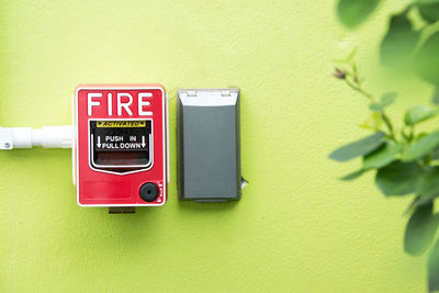 Close-up of fire alarm box on wall