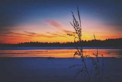 Scenic view of sunset over lake